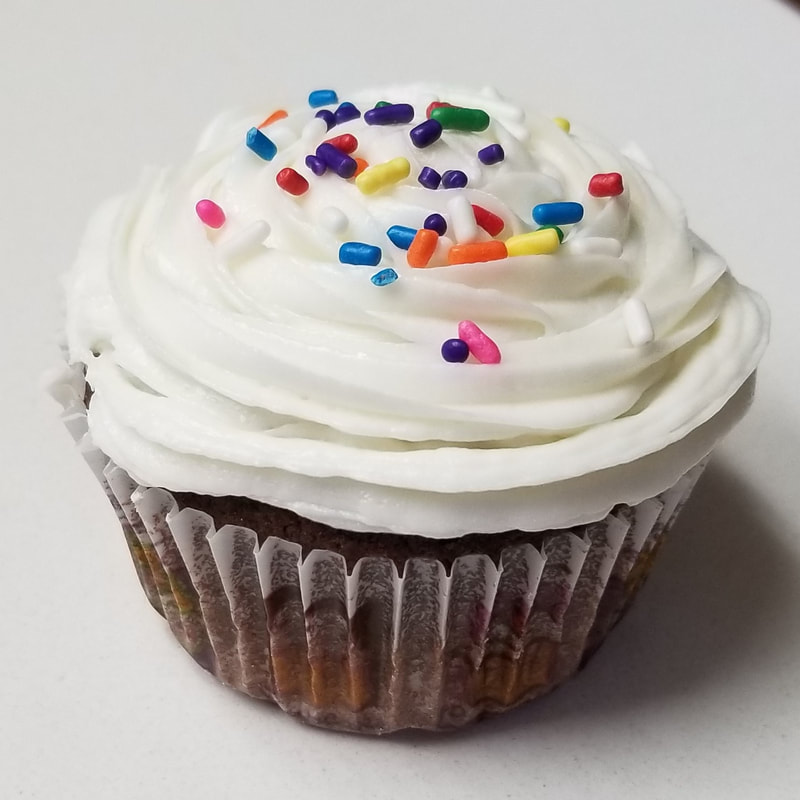 One delicious chocolate cupcake with sprinkles